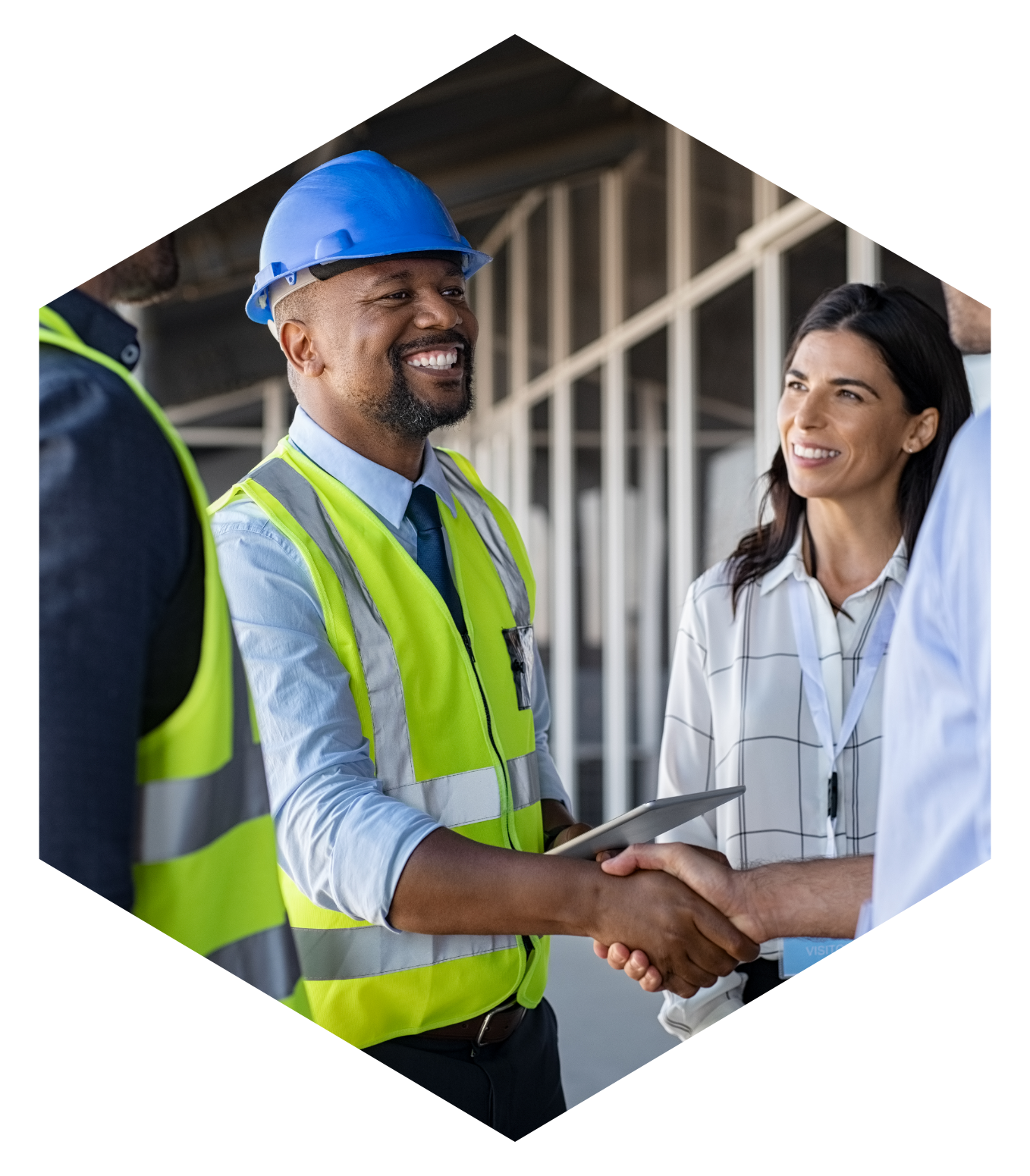 men shaking hands at a construction site